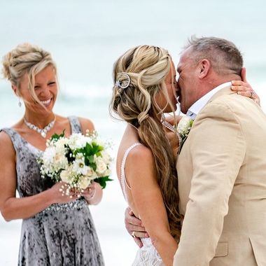 Newly married couple sharing a kiss