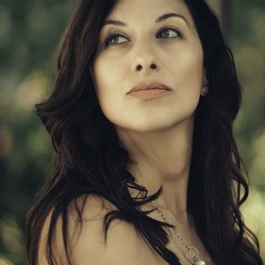 Warm editorial portrait with direct eye contact